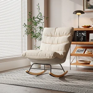 Ergonomische schommelstoel met beige kussen en grijs frame, modern design in stof/kunstleer.