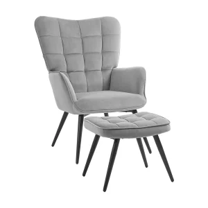 Fauteuil met kruk in lichtgrijs fluweel, zwarte metalen poten Fauteuil met kruk in lichtgrijs fluweel, zwarte metalen poten